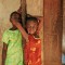 Photo 12: Mädchen vor dem dörflichen Haus im Masingini Forest, Sansibar 2008  © Werner Mansholt